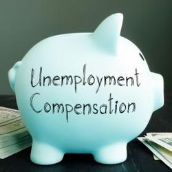 Unemployment Compensation written on piggy bank