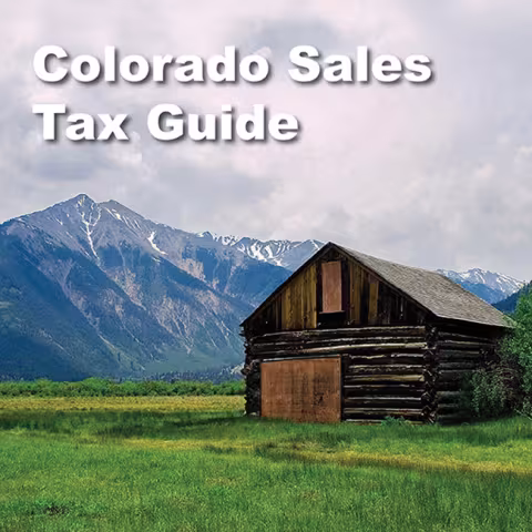 Colorado Sales Tax Guide Image featuring an image of a log cabin with a mountain scenery