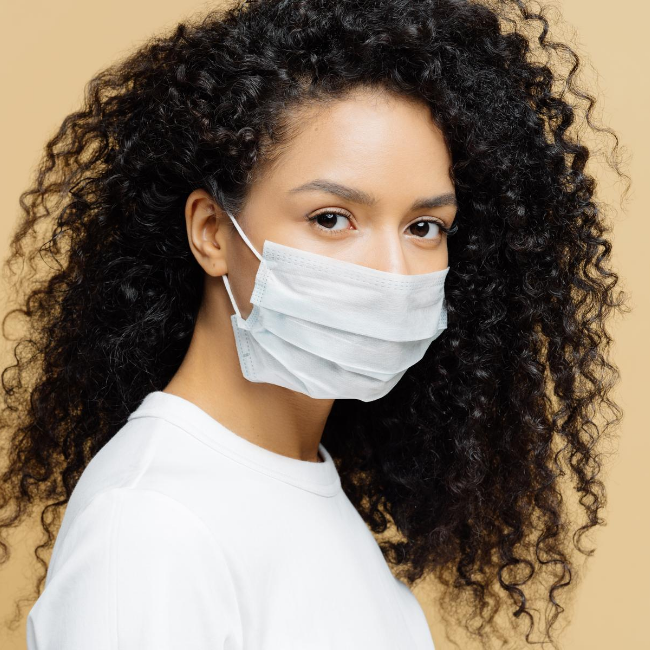 Woman Wearing Mask to Protect Herself and Others from airborne viruses